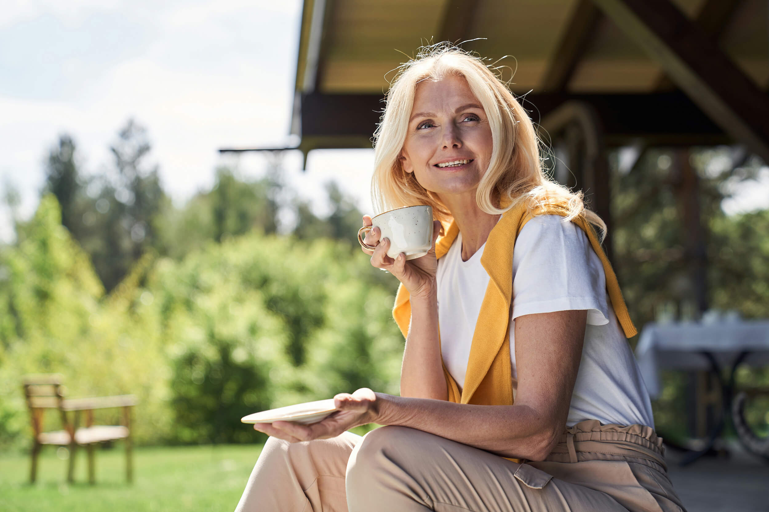 Woman sitting outdoors after non-surgical herniated disc care at Greenbrier Family Chiropractic in Chesapeake, VA