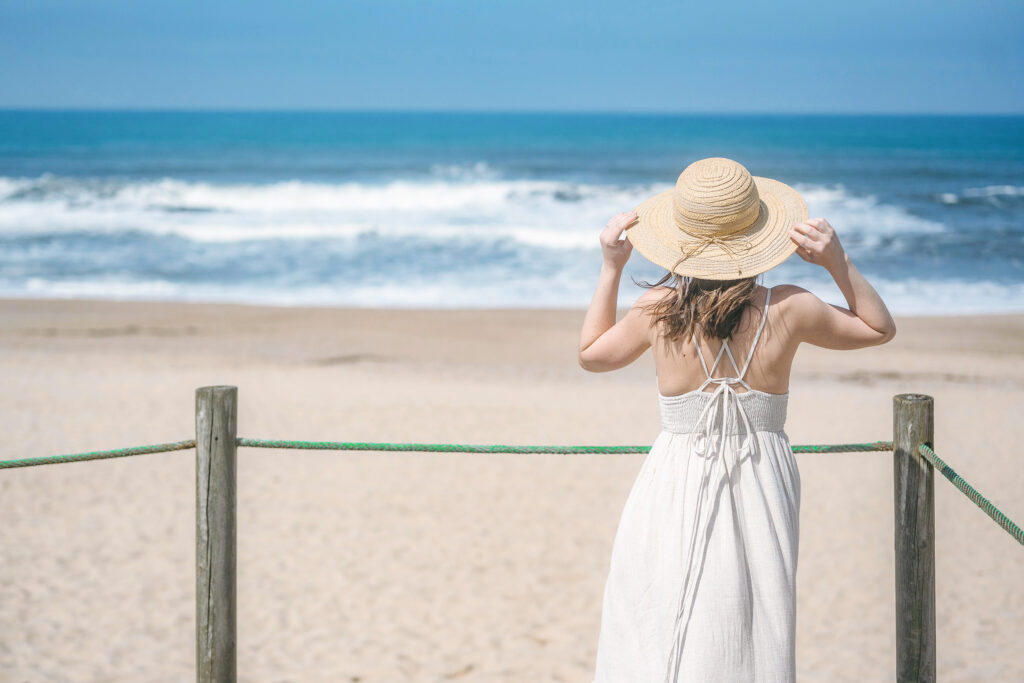 Woman looking at the ocean after natural chiropractic care visit