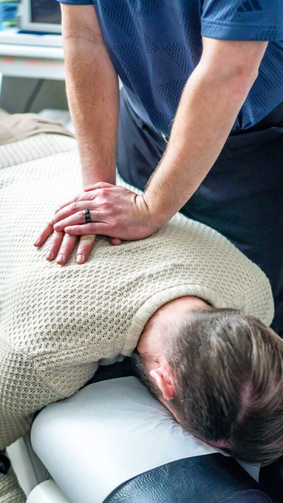 Man getting chiropractic adjustment at Greenbrier Family Chiropractic in Chesapeake, VA