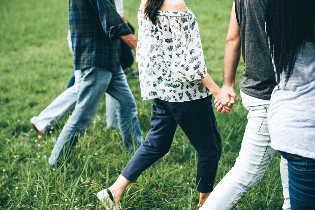 Group of people walking outside after natural pain relief with Greenbrier Family Chiropractic in Chesapeake, VA