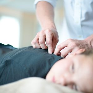 Girl getting chiropractic adjustment at Greenbrier Family Chiropractic in Chesapeake, VA