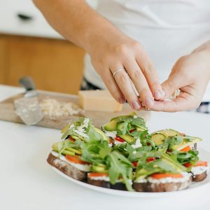 Woman making healthy snack after nutrition consultation at Greenbrier Family Chiropractic in Chesapeake, VA
